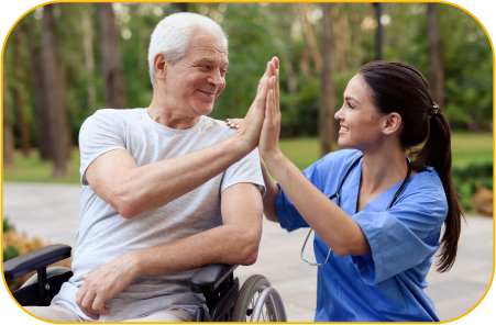 A young Thai nurse caregiver positively supports her neurological rehabilitation patient in garden at a rehabilitation center