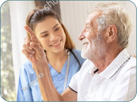 An elderly neurological patient discussing progress with his Thai rehabilitation nurse